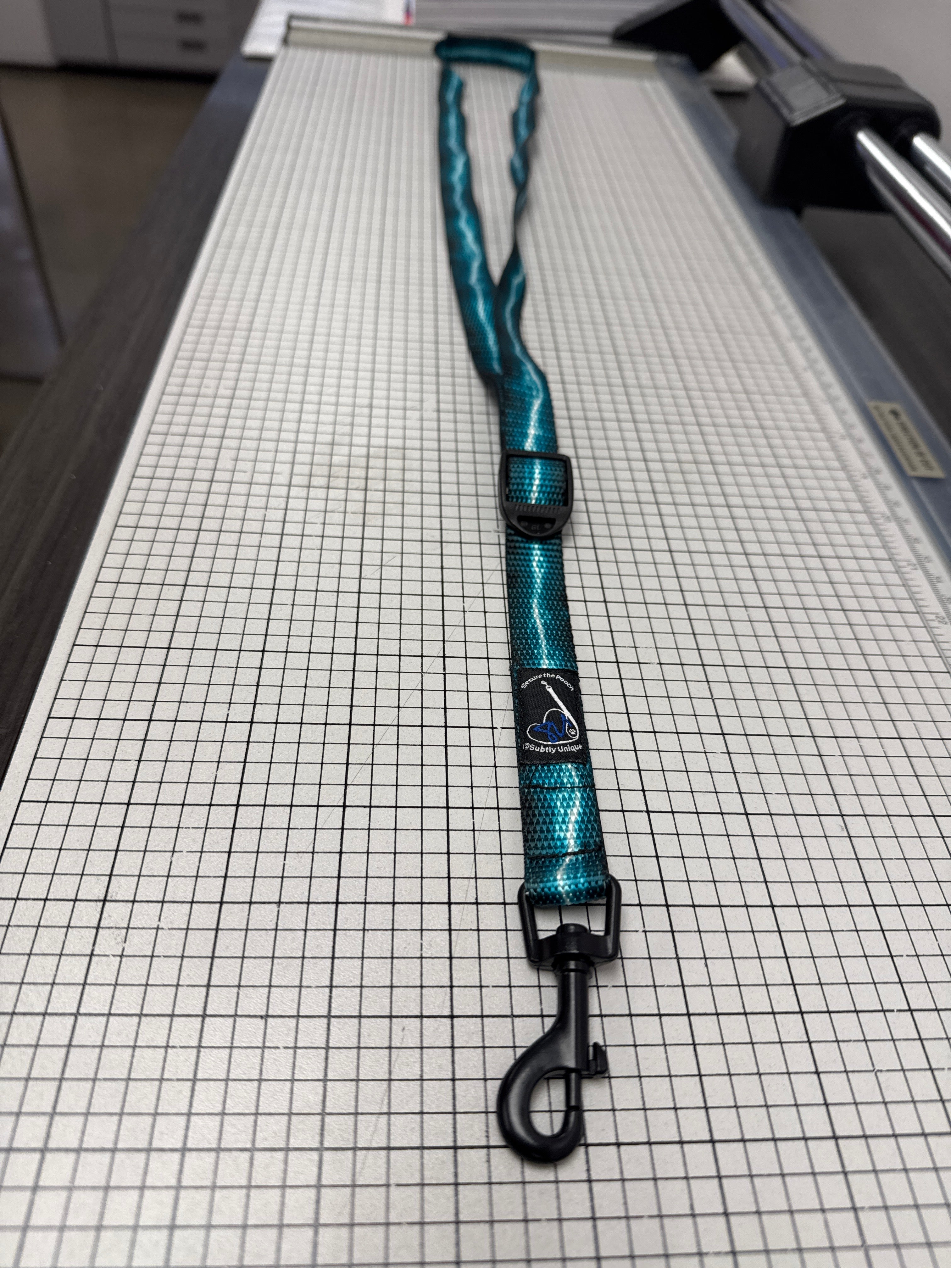 Turquoise Lightning Secure the Pooch Nekleash convertible key lanyard dog leash mini hook