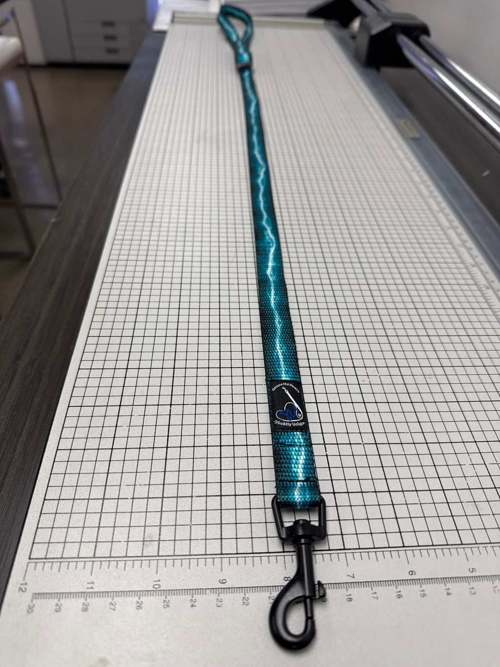 Turquoise Lightning Secure the Pooch Nekleash convertible key lanyard dog leash mini hook