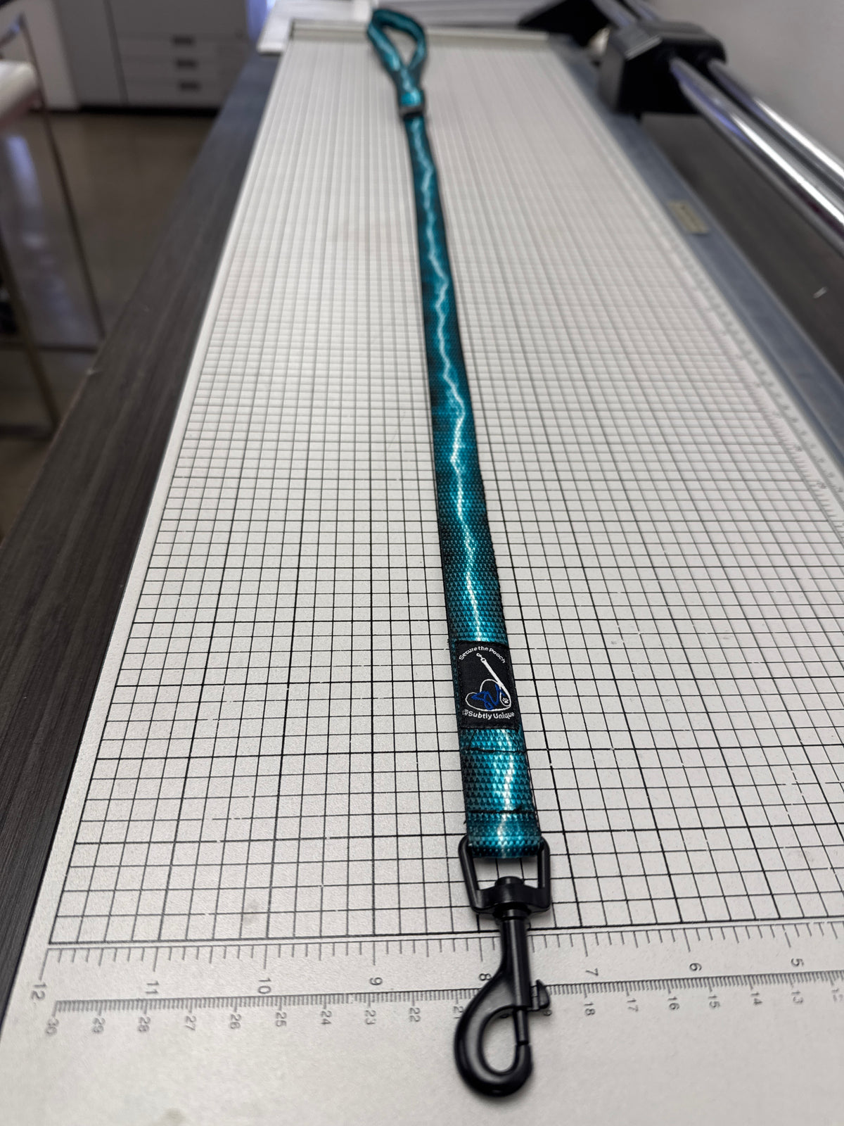 Turquoise Lightning Secure the Pooch Nekleash convertible key lanyard dog leash mini hook